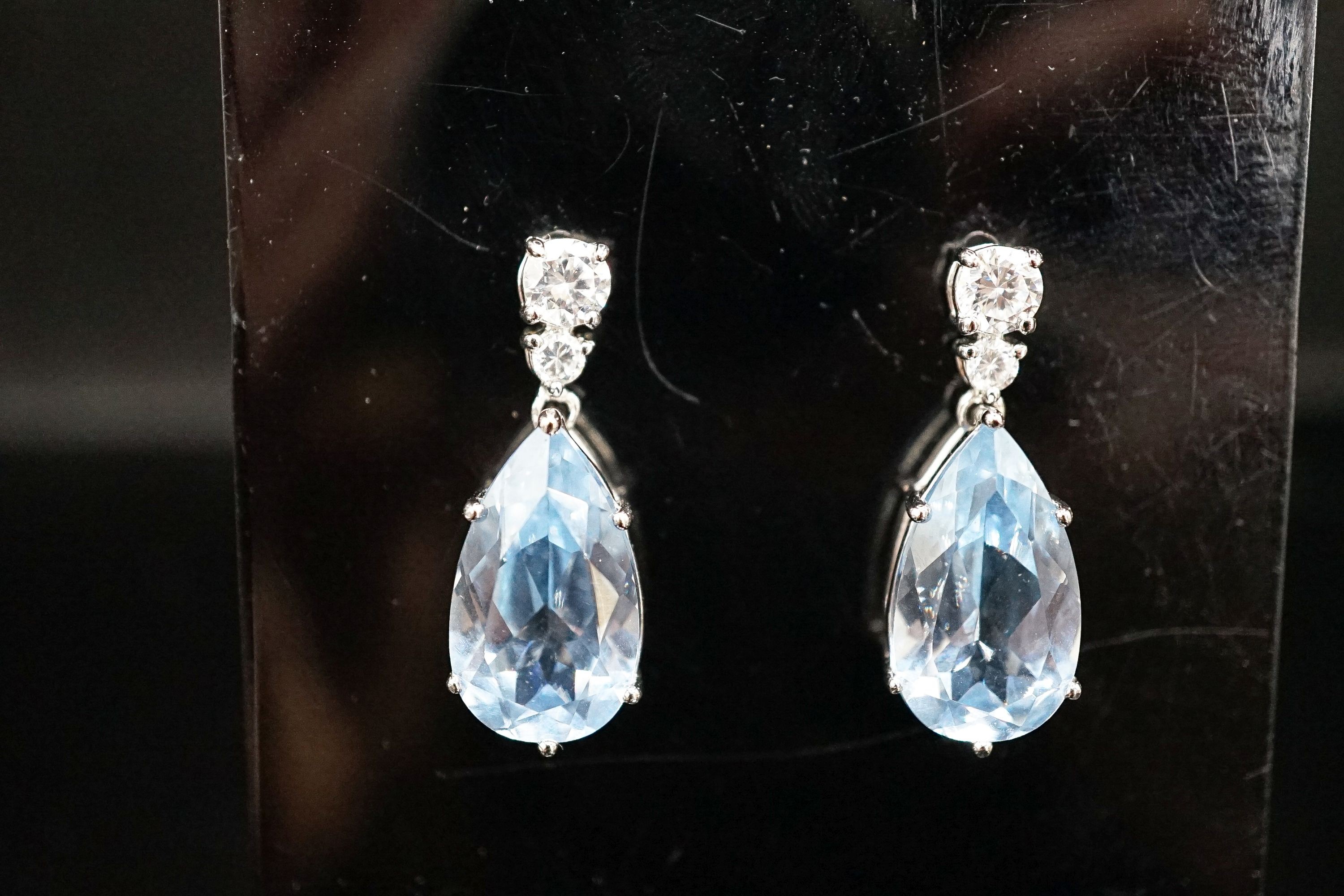 A pair of white metal and two colour cubic zirconia set pear shaped drop earrings, 30mm.